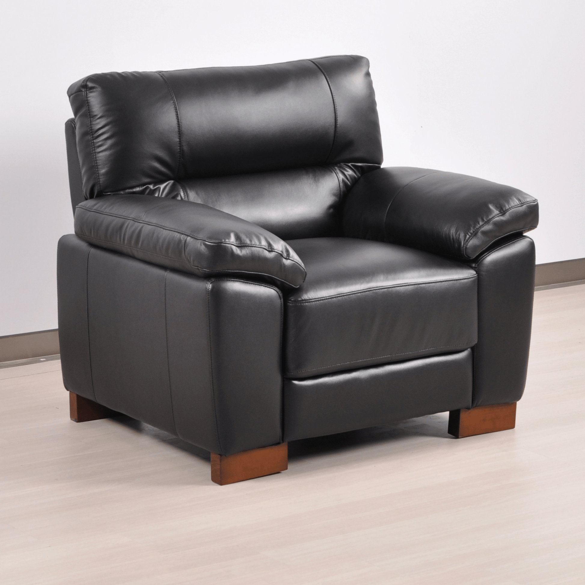 Dalmore Black armchair angled view on white background with modern sleek design