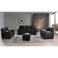 Dalmore Black 3+1+1 Sofa Combo – Stylish black fabric set with 3-seater sofa and two armchairs in a cozy room setting.