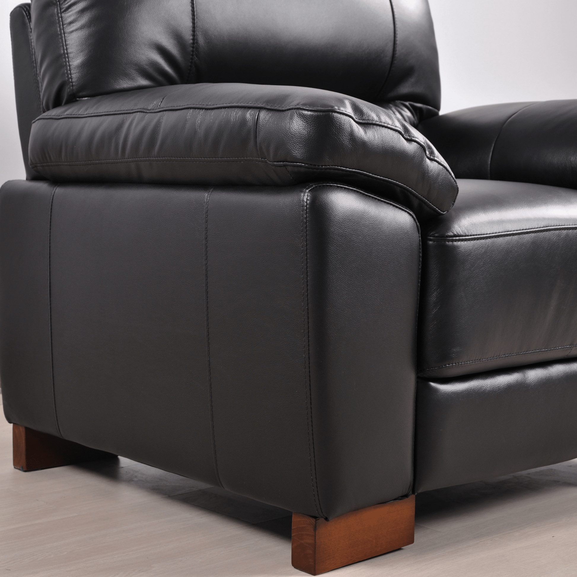 Dalmore Black Armchair – Close-up showcasing plush black fabric texture and detailed stitching craftsmanship.