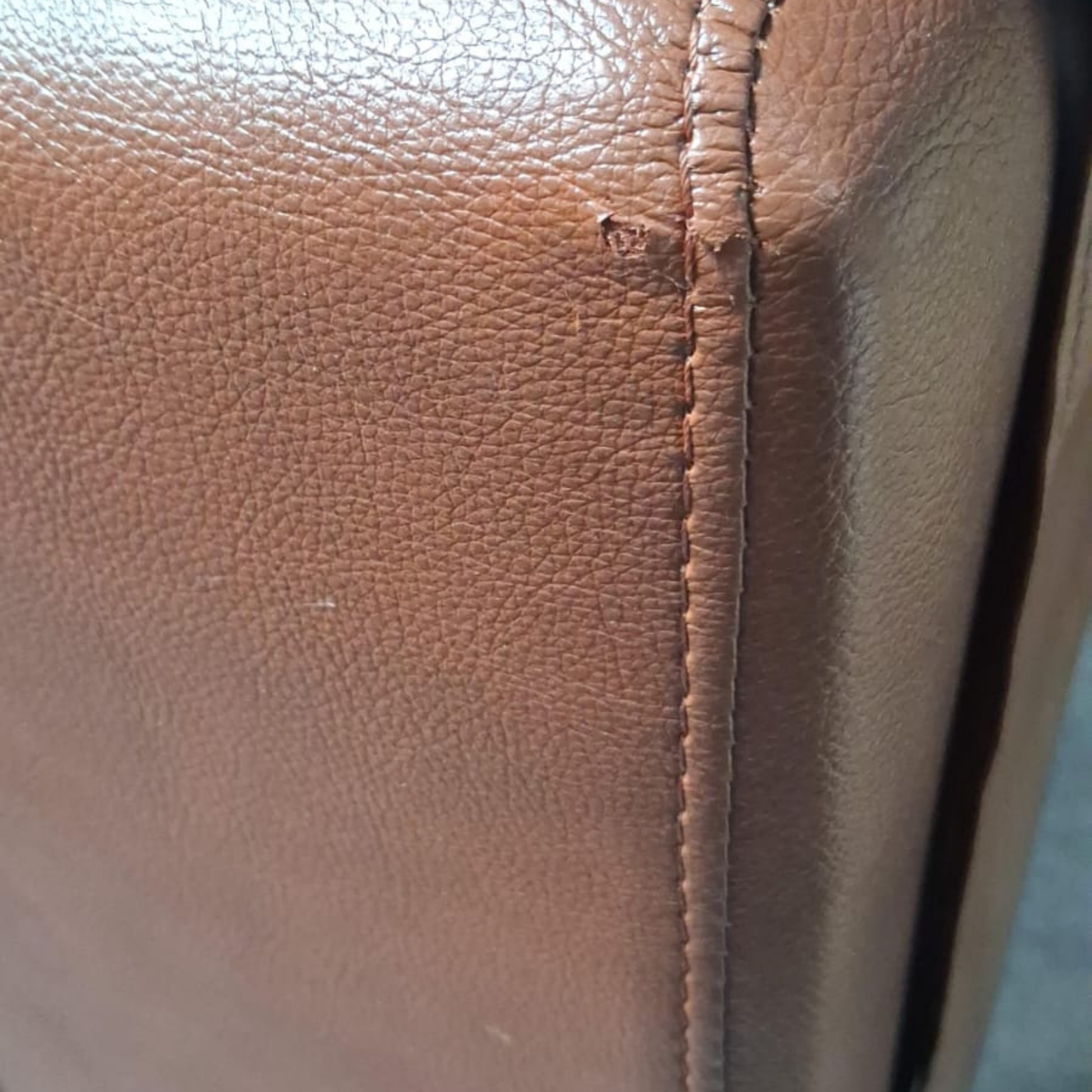 close up of genuine leather tan sofa
