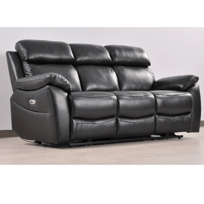 Black leather reclining sofa on a wooden floor with a white wall background