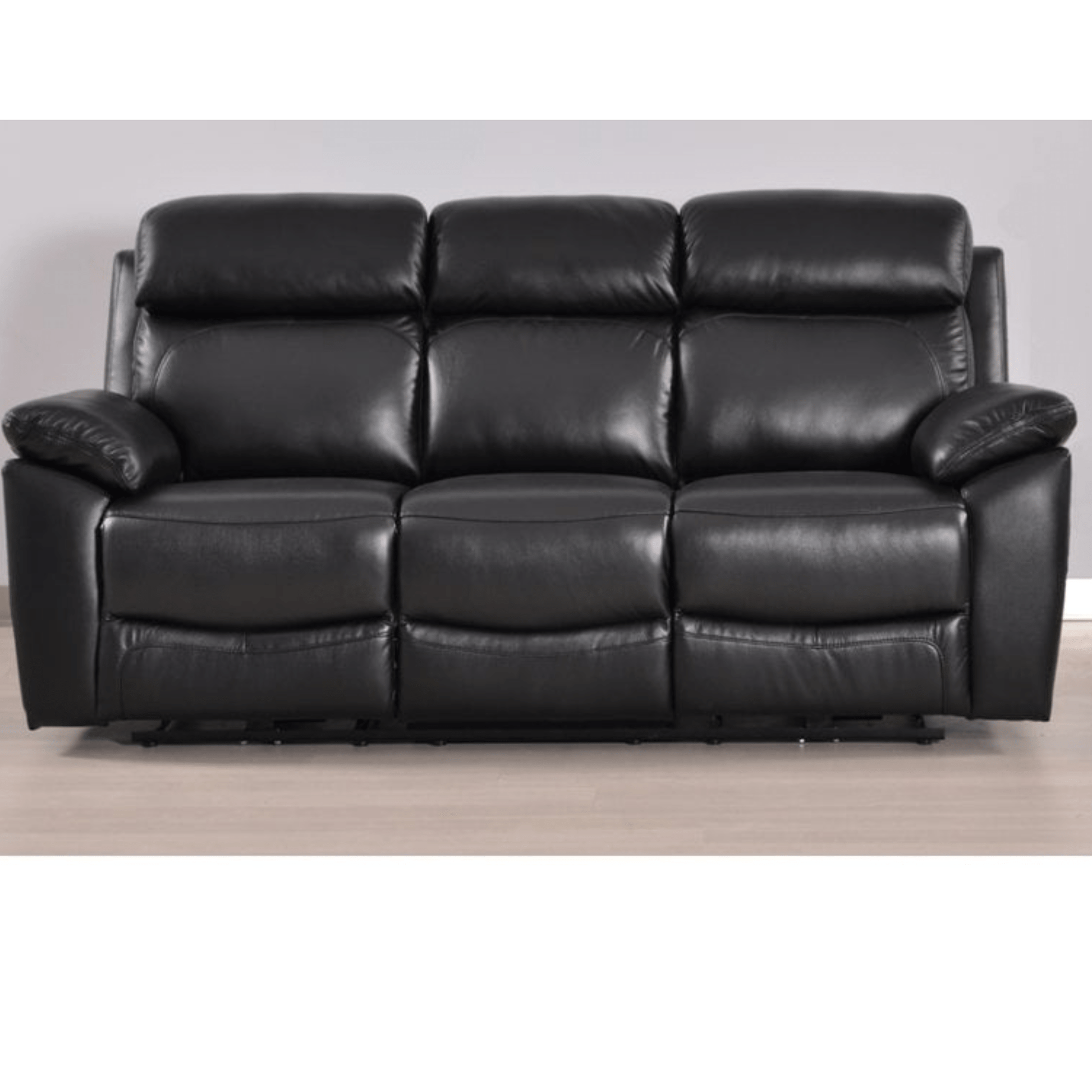 Black leather sofa on a wooden floor with a plain background