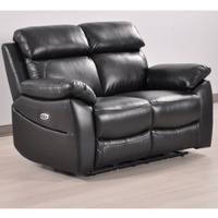 Black leather recliner sofa on a light wooden floor with a white wall background