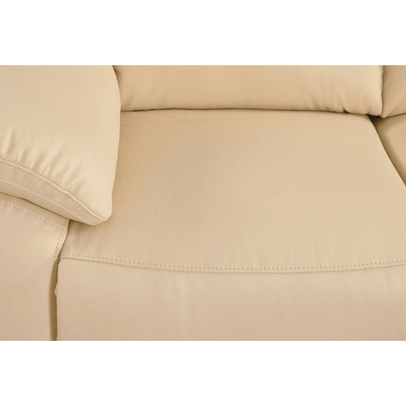 Close-up of a beige sofa with a pillow on a white background