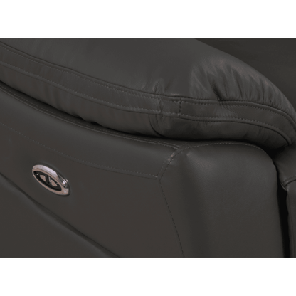 Close-up of a black leather seat with a visible brand logo on a white background