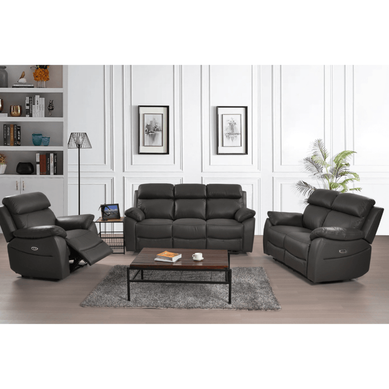 Black leather reclining sofa set in a living room setting with a coffee table and decor.