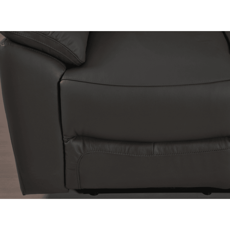 Close-up of a dark brown leather sofa corner on a white background