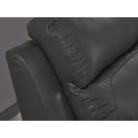 Close-up of a dark gray leather armchair with visible stitching.