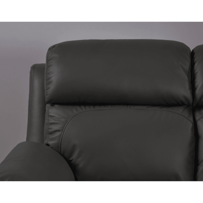 Close-up of a black leather sofa against a gray background