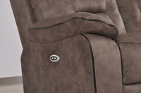 Brown fabric electric recliner armchair closeup showcasing plush cushioning and electric controls