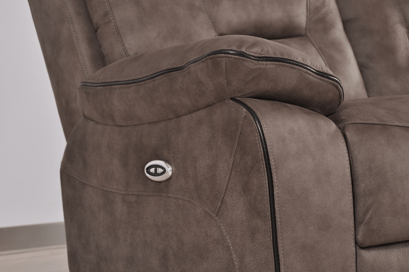 Brown fabric electric recliner armchair closeup showcasing plush cushioning and electric controls