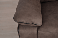 Closeup image of brown fabric 2 seater recliner sofa with focus on armrests and cushion detail