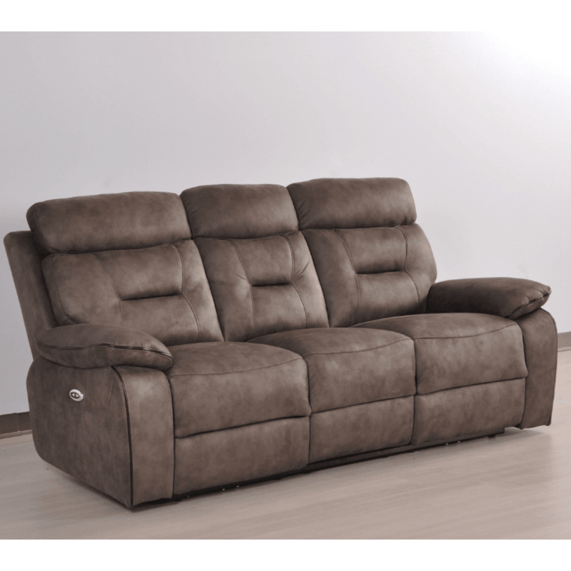 Brown reclining sofa on a light wooden floor with a white wall background