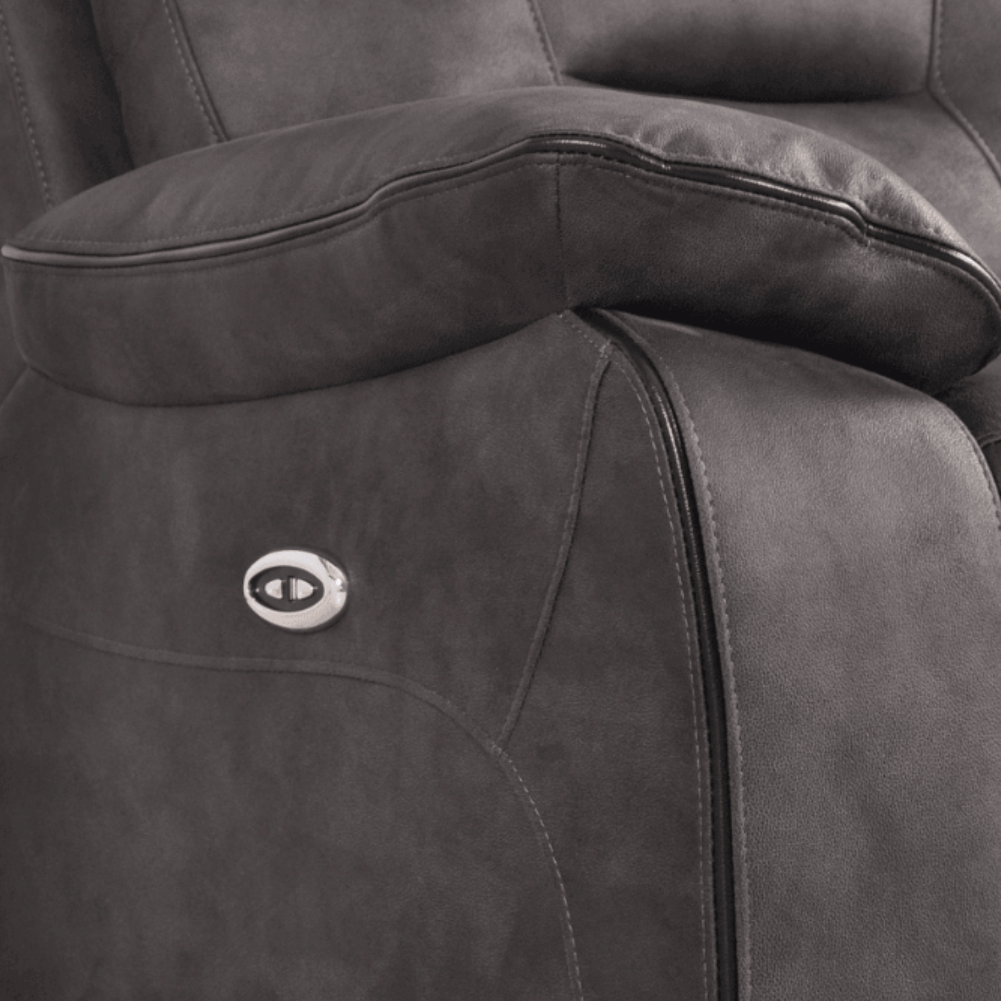 Gray recliner chair with a visible brand logo on the armrest.