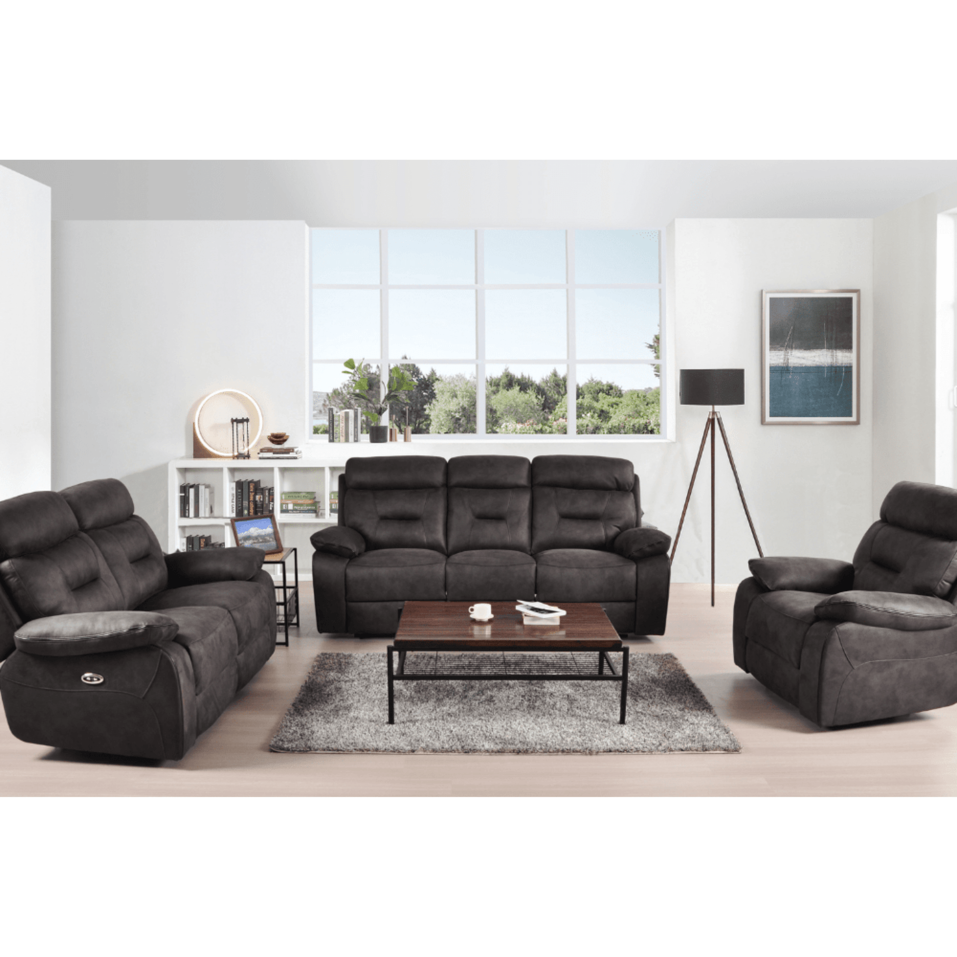Gray sofa set in a living room with a coffee table and decor items.