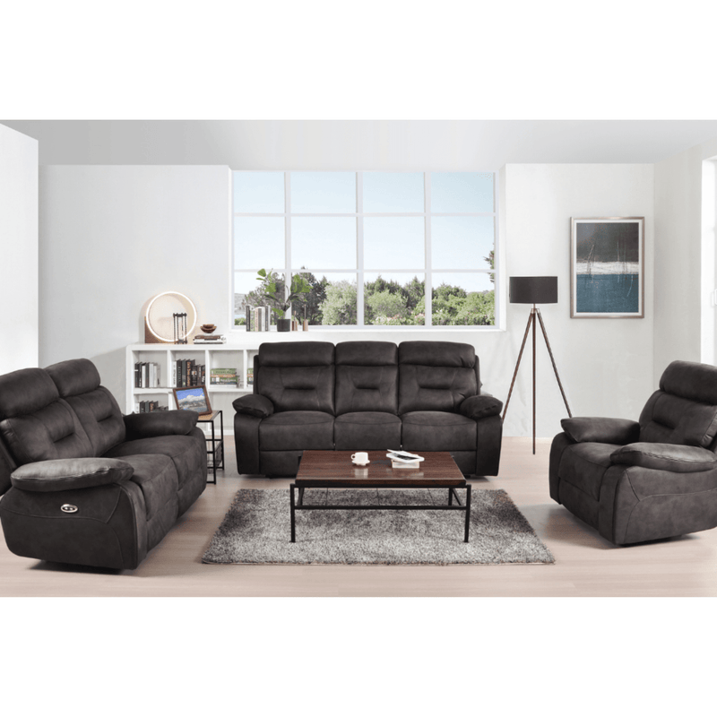 Gray sofa set in a living room with a coffee table and decor items.