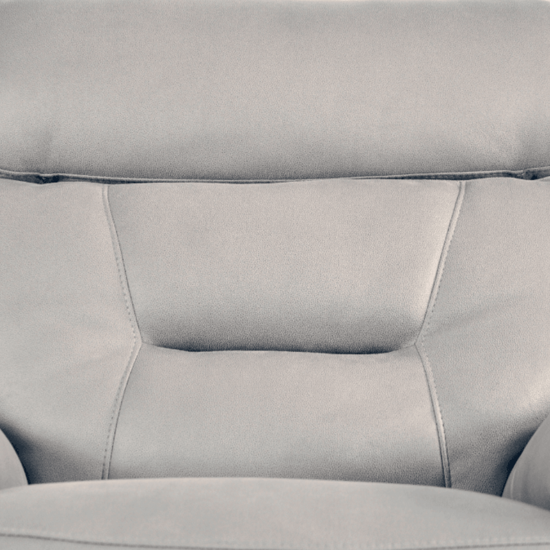 Close-up of a gray leather sofa with visible stitching