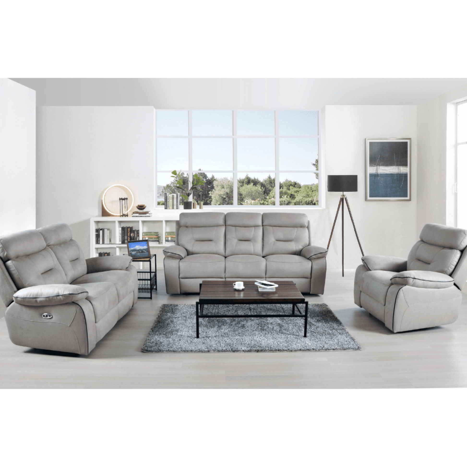 Gray sofa set in a modern living room with a coffee table and decor items.