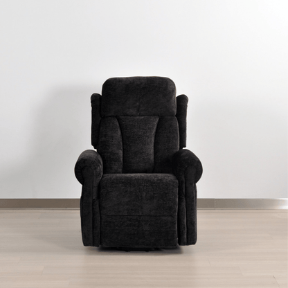 Dark gray recliner chair on a light wooden floor with a white wall background