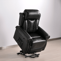 Black leather recliner chair in a room with a light gray wall and wooden floor.
