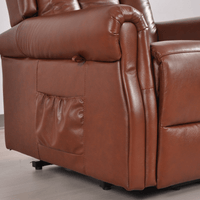 Brown leather recliner chair on a neutral background