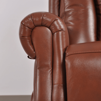 Close-up of a brown leather armchair with a blurred background