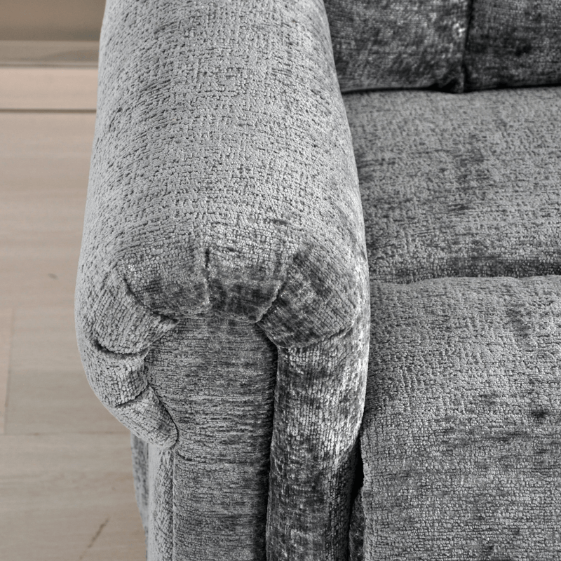 Gray textured sofa with a wooden floor in the background