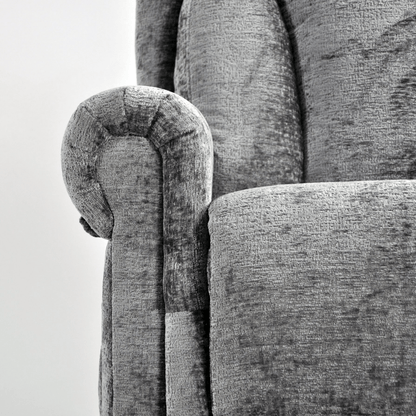 Close-up of a textured gray sofa with wooden armrest detail.