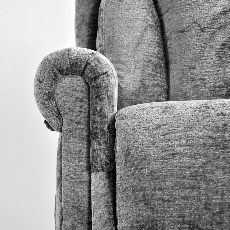 Close-up of a textured gray sofa with wooden armrest detail.