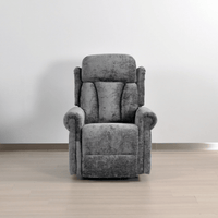 Gray recliner chair in a room with a plain background