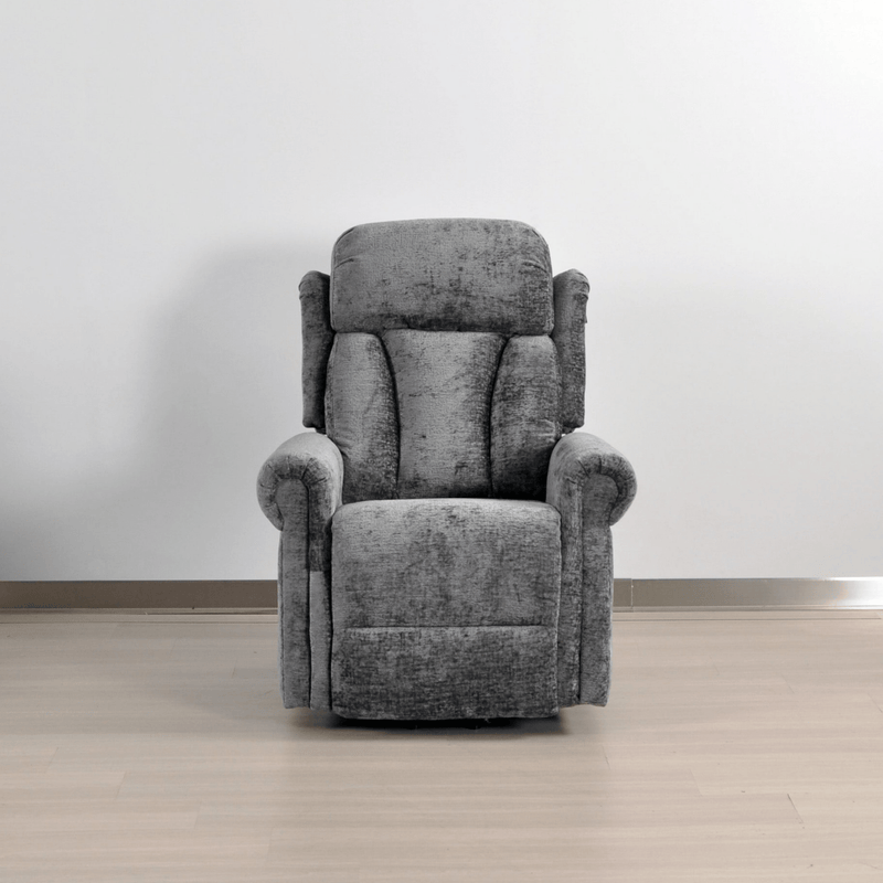 Gray recliner chair in a room with a plain background