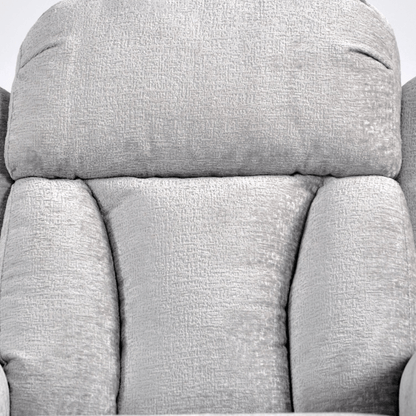 Close-up of a gray fabric armchair with a textured pattern.