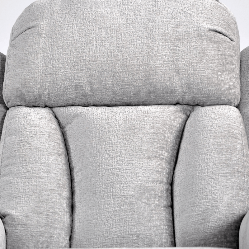 Close-up of a gray fabric armchair with a textured pattern.
