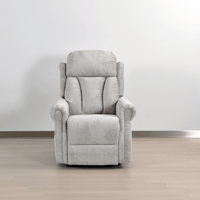 Gray recliner chair on a wooden floor with a white wall background