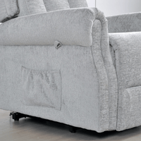 Gray fabric sofa with a visible wear pattern on the armrest.