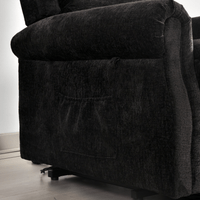 Dark gray recliner chair with a textured fabric finish on a light wooden floor.