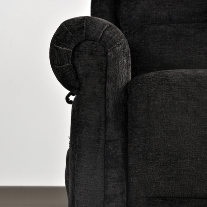 Close-up of a dark gray upholstered chair with armrest detail.