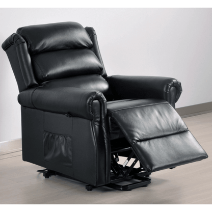 Black leather recliner chair with armrests and footrest on a light wooden floor.