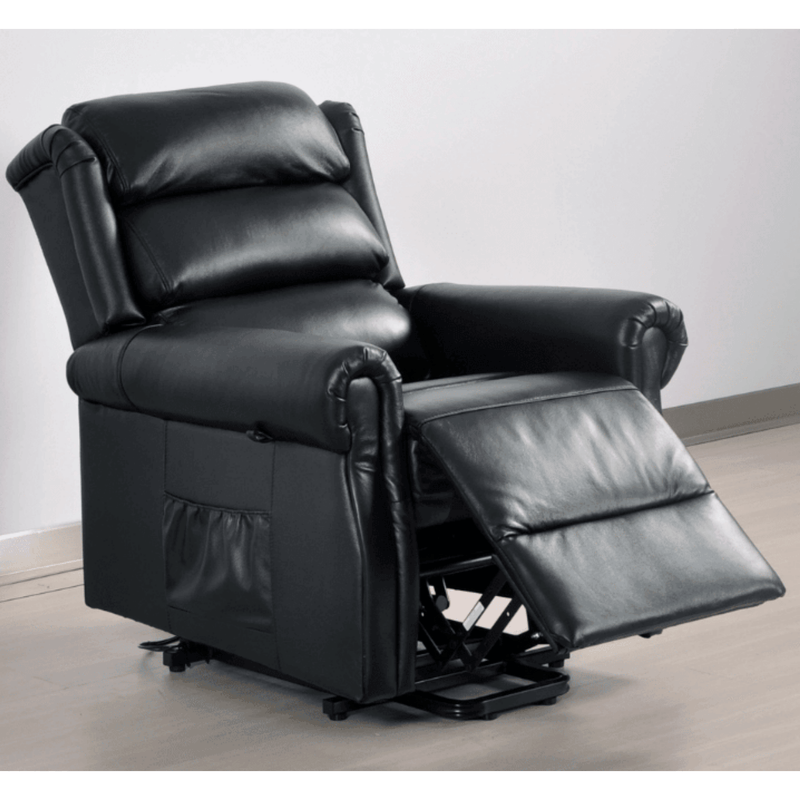 Black leather recliner chair with armrests and footrest on a light wooden floor.