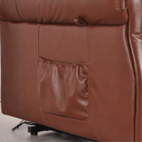 Close-up of a brown leather recliner chair with visible stitching.