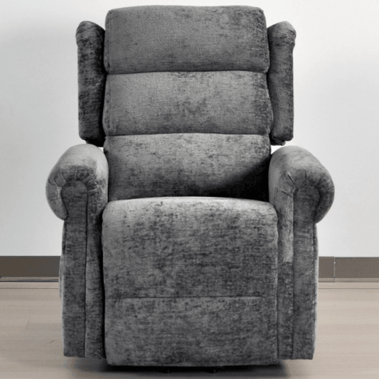 Gray recliner chair on a light wooden floor with a white wall background