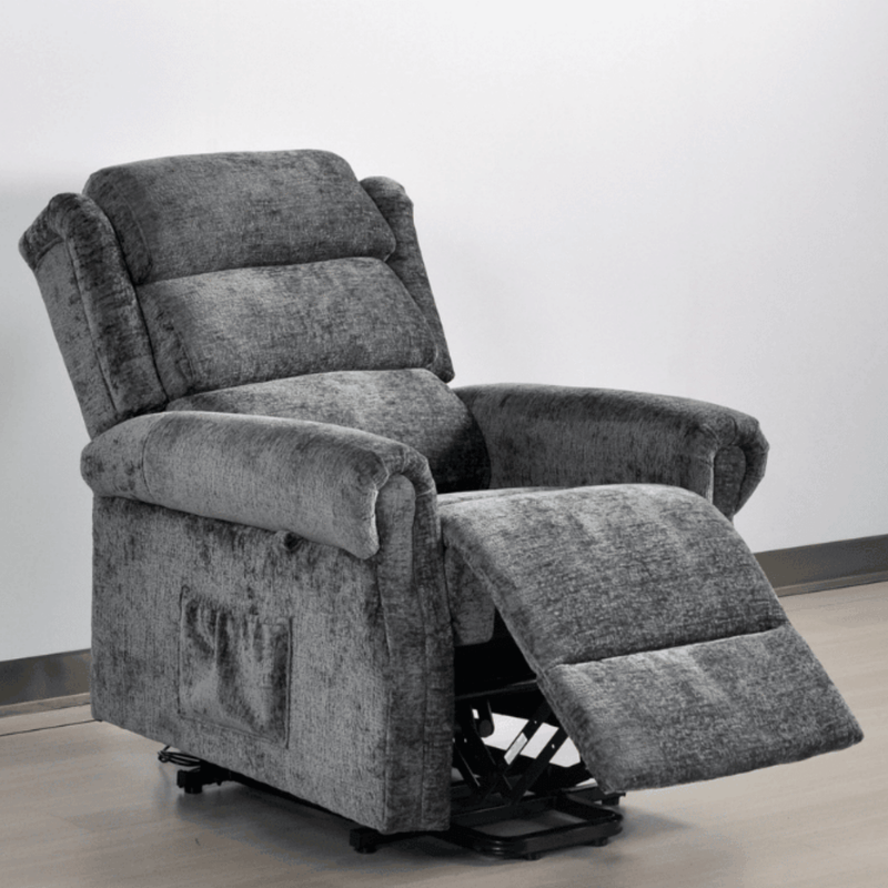 Gray recliner chair with armrests and footrest on a plain background