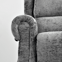 Gray upholstered chair with a textured fabric finish on a white background