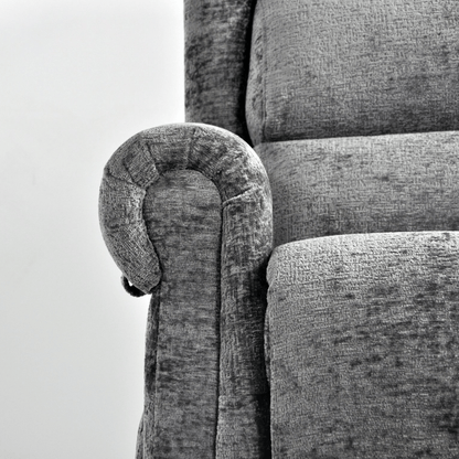 Gray upholstered chair with a curved armrest on a white background