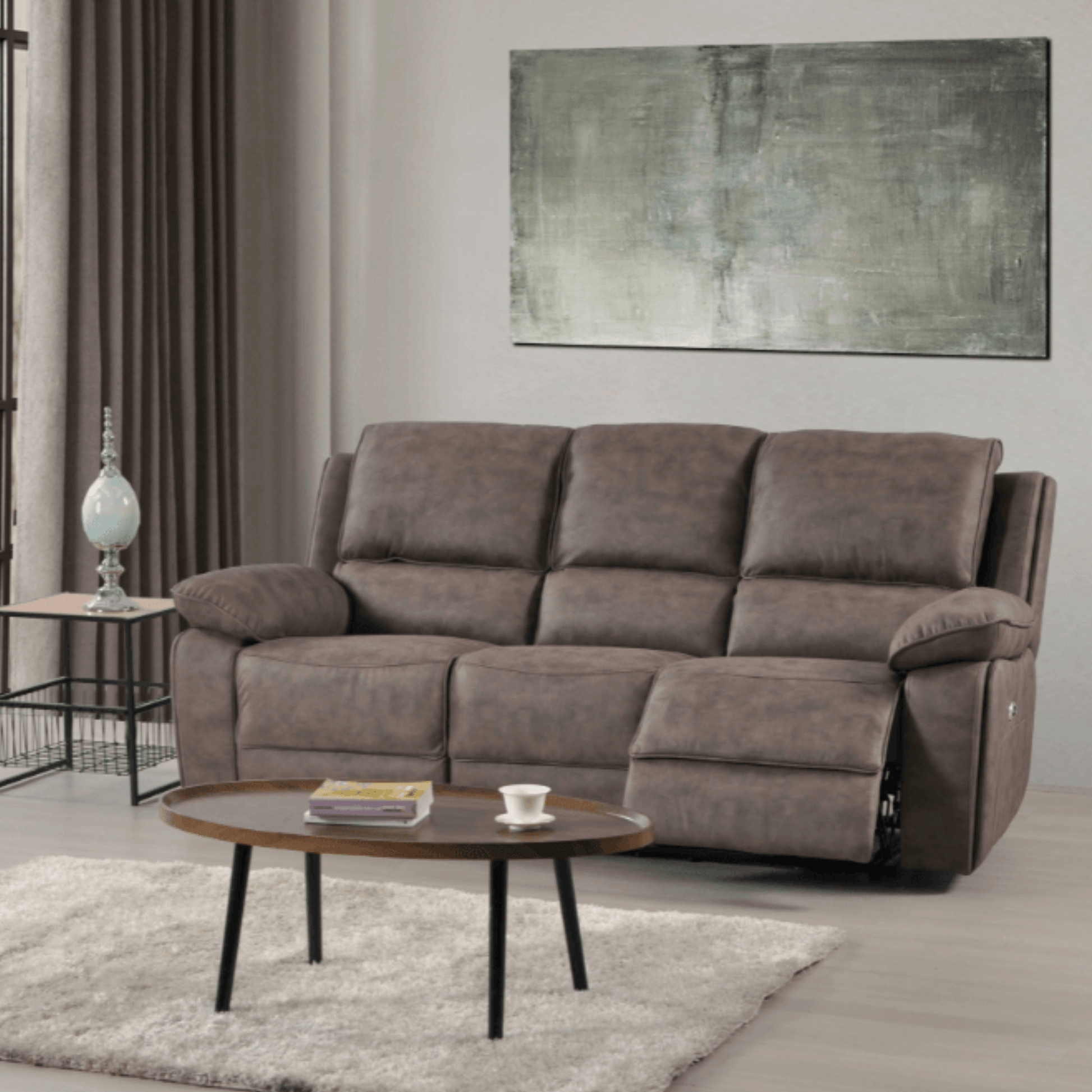 Brown sofa in a living room with a coffee table and abstract painting on the wall.