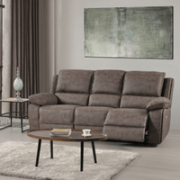 Brown sofa in a living room with a coffee table and abstract painting on the wall.