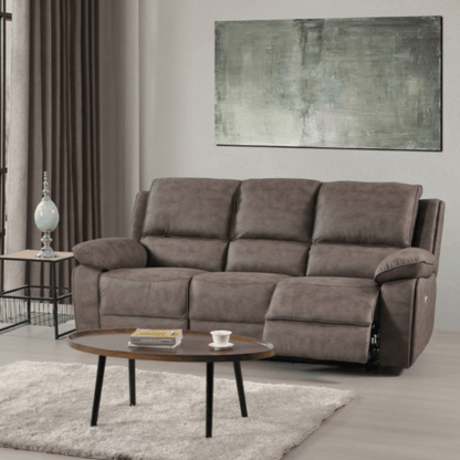 Brown sofa in a living room with a coffee table and abstract painting on the wall.