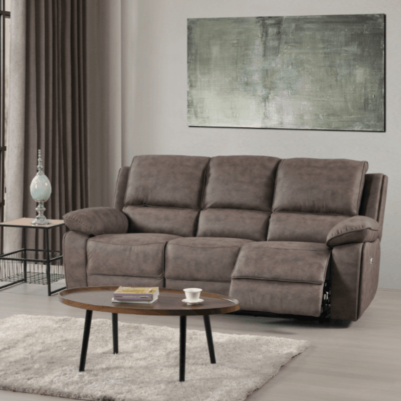 Brown sofa in a living room with a coffee table and abstract painting on the wall.