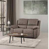 Brown sofa in a living room with a coffee table and decorative items.