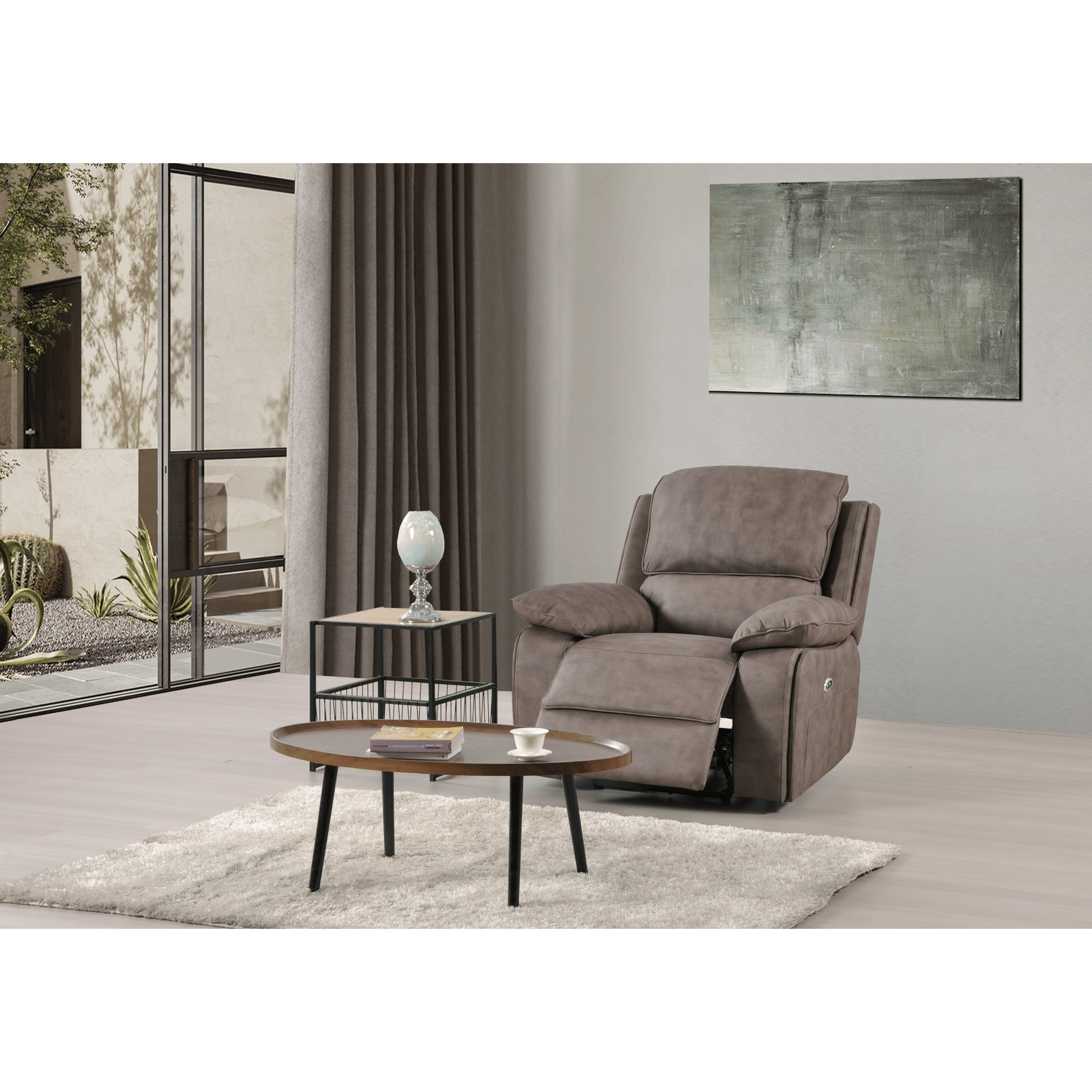 Gray recliner chair in a living room setting with a coffee table and decorative items.